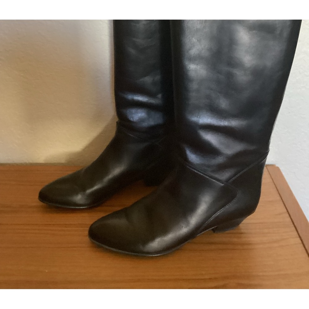 Black leather made in Italy knee-high boots.
